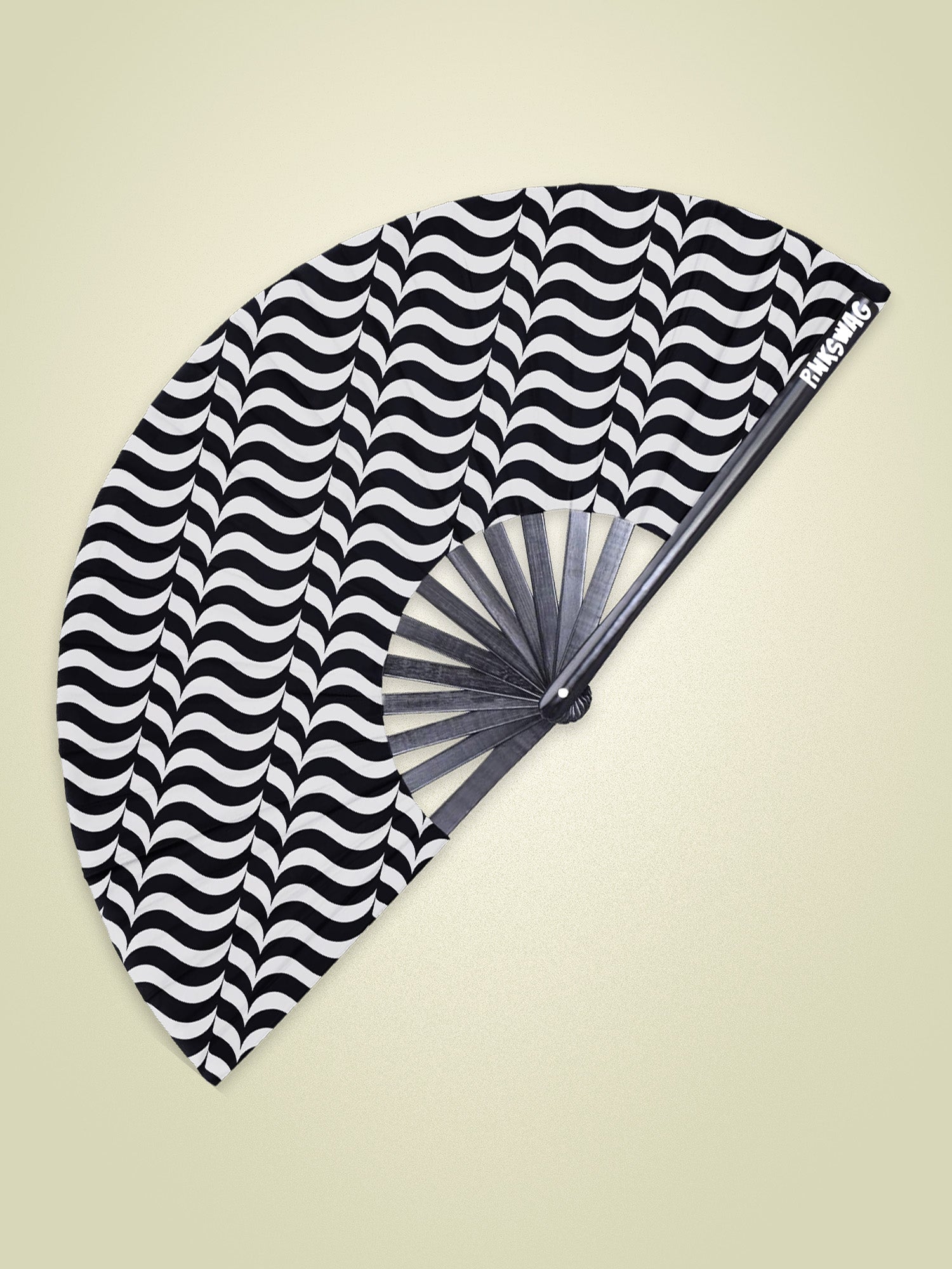 Black and white striped fan on a beige background