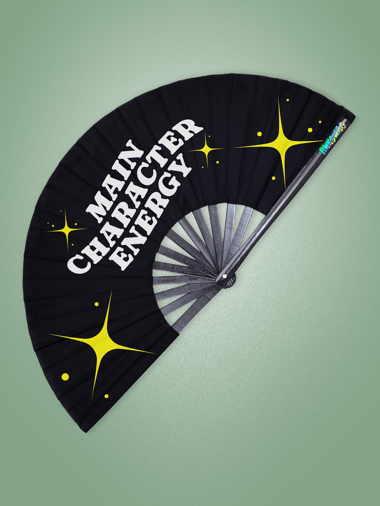 Black fan with 'MAIN CHARACTER ENERGY' text and yellow stars on a green background