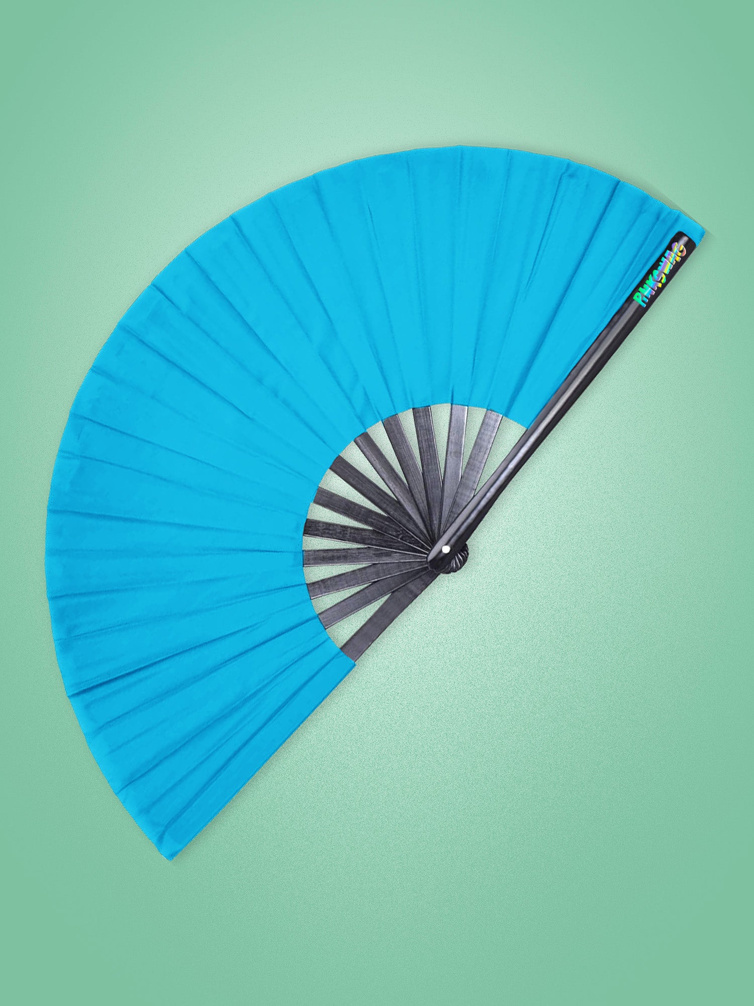 Blue fan with black center on a green background